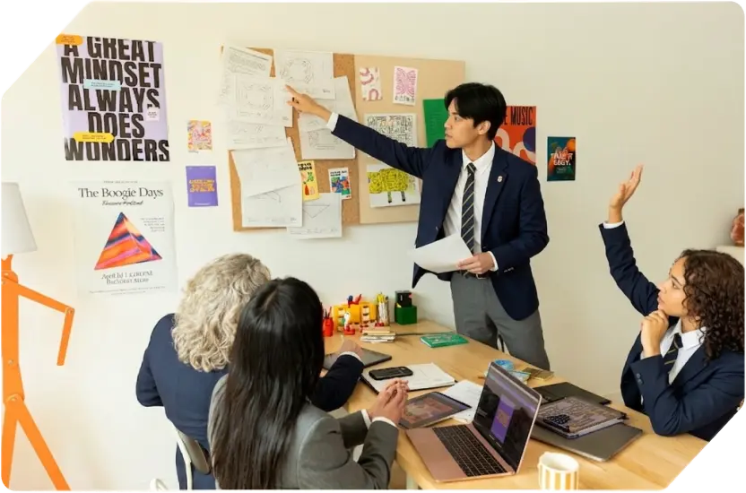 Students and mentor collaborating in a workshop setting